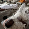 Bệnh nhân mắc bệnh tả được điều trj tại bệnh viện ở Port-au-Prince, Haiti. (Ảnh: AFP/TTXVN)