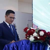 Phó Cục trưởng Cục Xúc tiến Thương mại (Bộ Công thương Lào) Somvixay Vongthirath phát biểu tại Hội thảo. (Ảnh: Phạm Kiên/TTXVN)