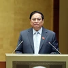 Thủ tướng Phạm Minh Chính phát biểu làm rõ các vấn đề liên quan trước Quốc hội. (Ảnh: Phạm Kiên/TTXVN)