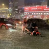 Nhiều tuyến đường chính của Đà Nẵng ngập sâu do mưa lớn ngày 14/10. (Ảnh: Văn Dũng/TTXVN)