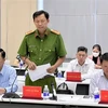 Thượng tá Nguyễn Minh Thân, Phó trưởng phòng tham mưu Công an tỉnh Bình Dương, thông tin tại cuộc họp báo cung cấp thông tin về tình hình kinh tế-xã hội năm 12/2022 tại tỉnh Bình Dương. (Ảnh: Huyền Trang/TTXVN)
