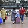 Hành khách tại nhà ga ở Bắc Kinh, Trung Quốc. (Ảnh: THX/TTXVN)