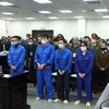 Các bị cáo tại phiên tòa ngày 26/12/2022. (Ảnh: Phạm Kiên/TTXVN)