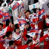 Các vận động viên từ cả hai miền Triều Tiên diễu hành dưới một lá cờ thống nhất tại Thế vận hội mùa đông 2018 ở Pyeongchang, Hàn Quốc. (Nguồn: Reuters)