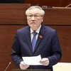 Chánh án Tòa án nhân dân tối cao Nguyễn Hòa Bình trả lời chất vấn. (Ảnh: Doãn Tấn/TTXVN)
