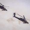 Máy bay AH-64 Apache của quân đội Mỹ tham gia tập trận ngày 30/6/2022. (Ảnh: AFP/TTXVN)