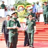 Truy điệu, an táng 19 liệt sỹ là quân tình nguyện, chuyên gia Việt Nam hy sinh tại Lào. (Ảnh: Đức Thọ/TTXVN)