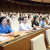 Đoàn đại biểu Quốc hội tỉnh Yên Bái biểu quyết thông qua Luật Giá (sửa đổi), Nghị quyết về phê chuẩn quyết toán Ngân sách nhà nước năm 2021. (Ảnh: Doãn Tấn/TTXVN)