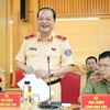 Thiếu tướng Lê Xuân Đức, Phó Cục trưởng Cục Cảnh sát Giao thông trả lời câu hỏi của các phóng viên. (Ảnh: Phạm Kiên/TTXVN)