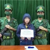 Đối tượng Nguyễn Thị Huế bị bắt giữ. (Ảnh: TTXVN phát)