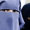 Phụ nữ Hồi giáo phải đeo mạng che kín mặt khi ra đường. (Ảnh: Sputnik/TTXVN)