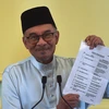 Thủ tướng Malaysia Anwar Ibrahim tại cuộc họp báo công bố danh sách nội các mới tại Putrajaya, ngày 2/12/2022. (Ảnh: AFP/TTXVN)
