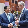 Thủ tướng Phạm Minh Chính trao đổi với Thủ tướng Australia Anthony Albanese tại Hội nghị Cấp cao ASEAN-Australia lần thứ 3. (Ảnh: Dương Giang/TTXVN)
