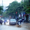 Mưa lớn gây ngập úng tại Quốc lộ 6 (đoạn qua khu vực đường Trường Chinh), thành phố Sơn La. (Ảnh: Quang Quyết/TTXVN)