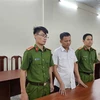 Cơ quan Điều tra bắt giam Lê Văn Ngọc. (Ảnh: TTXVN phát)
