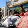 Người dân Palestine sơ tán tránh chiến sự ở Dải Gaza. (Ảnh: THX/TTXVN)