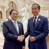 Thủ tướng Phạm Minh Chính gặp Tổng thống Indonesia Yoko Widodo. (Ảnh: TTXVN)
