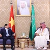 Thủ tướng Phạm Minh Chính gặp Thủ tướng, Thái tử Saudi Arabia Mohammad bin Salman. (Ảnh: Dương Giang/TTXVN)
