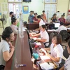Người dân có thẻ Bảo hiểm Y tế làm thủ tục khám, chữa bệnh tại Bệnh viện Đa khoa tỉnh Sơn La. (Ảnh: Hữu Quyết/TTXVN)
