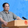 Thủ tướng Phạm Minh Chính chủ trì Hội nghị tổng kết Công tác Phòng, Chống dịch COVID-19. (Ảnh: Dương Giang/TTXVN)