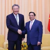 Thủ tướng Phạm Minh Chính tiếp Bộ trưởng Thương mại Trung Quốc Vương Văn Đào. (Ảnh: Dương Giang/TTXVN)
