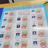 Danh sách các giáo viên của trường THPT Nguyễn Du (huyện Châu Đức, tỉnh Bà Rịa-Vũng Tàu) đăng ký hiến xác cho nghiên cứu y học. (Ảnh: Hoàng Nhị/TTXVN)