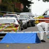 Cảnh sát điều tra tại hiện trường một vụ giết người tại Birmingham, Anh. (Ảnh: AFP/TTXVN)