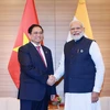 Thủ tướng Phạm Minh Chính hội kiến Thủ tướng Ấn Độ Narendra Modi tại Hiroshima, Nhật Bản, sáng 20/5/2023. (Ảnh: Dương Giang/TTXVN)