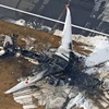 Hiện trường vụ tai nạn máy bay của Japan Airlines tại Sân bay Haneda. (Ảnh: Kyodo/TTXVN) 