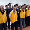 Cảnh sát Trung Quóc bắt giữ một nhóm tội phạm. (Nguồn: Xinhua)
