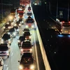 Dòng xe dài 4km di chuyển chậm trên cao tốc Phan Thiết-Dầu Giây sau vụ va chạm liên hoàn liên quan đến 4 xe ôtô. (Ảnh: Lê Xuân/TTXVN)