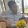 Đối tượng Lê Hải (sinh năm 1970, hiện đang công tác tại Ủy ban Kiểm tra Tỉnh ủy tỉnh Phú Yên, trước đây Hải công tác tại Viện kiểm sát Nhân dân tỉnh Phú Yên) khi bị bắt. (Ảnh: TTXVN phát)