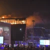 Lửa cháy dữ dội tại hiện trường vụ tấn công nhằm vào trung tâm thương mại “Crocus City Hall” ở Moskva, Nga tối 22/3/2024. (Ảnh: THX/TTXVN)