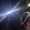 Nhân viên cứu hộ làm nhiệm vụ tại hiện trường vụ sập mỏ vàng ở huyện Zeysk, vùng Viễn Đông Nga ngày 19/3. (Ảnh: AFP/TTXVN)