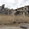 Một tòa nhà bị phá hủy sau cuộc không kích tại tỉnh Deir Ezzor, miền Đông Syria ngày 26/3. (Ảnh: AFP/TTXVN)