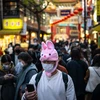 Người dân ở trên phố tại Kanagawa, Nhật Bản. (Ảnh: AFP/TTXVN)