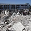 Tòa chung cư bị phá hủy sau vụ oanh tạc của Israel xuống thành phố Deir al-Balah ở miền Trung Dải Gaza ngày 7/6. (Ảnh: THX/TTXVN)