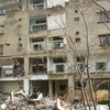 Một tòa nhà bị phá hủy sau cuộc không kích của Israel xuống thành phố Nabatieh, Liban. (Ảnh: AFP/TTXVN)