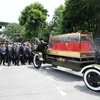 Xe chở linh cữu Tổng Bí thư Nguyễn Phú Trọng rời Nhà tang lễ Quốc gia. (Ảnh: TTXVN)