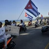 Người dân Cuba tuần hành kêu gọi Mỹ dỡ bỏ lệnh cấm vận tại thủ đô La Habana, Cuba ngày 28/3/2021. (Ảnh: AFP/TTXVN)