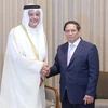 Thủ tướng Phạm Minh Chính tiếp Bộ trưởng Bộ Thông tin và Công nghệ Truyền thông Qatar Mohammed bin Ali bin Mohammed Al Mannai. (Ảnh: Dương Giang/TTXVN)