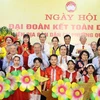 Tổng Bí thư Tô Lâm, Chủ tịch Quốc hội Trần Thanh Mẫn với cán bộ, nhân dân Phường Quán Thánh, Quận Ba Đình, Hà Nội. (Ảnh: Thống Nhất/TTXVN)