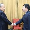 Phó Thủ tướng, Bộ trưởng Ngoại giao Phạm Bình Minh tiếp ông Lý Triệu Tinh. (Ảnh: Lâm Khánh/TTXVN)