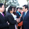 Chủ tịch nước Trương Tấn Sang gặp gỡ Kiều bào từ các nước trên thế giới về Việt Nam đón Tết cổ truyền dân tộc. (Ảnh: Nguyễn Khang/TTXVN)