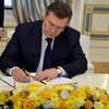 Tổng thống Ukrraine bị phế truất Viktor Yanukovych tại lễ ký thỏa thuận ở Kiev ngày 21/2 vừa qua. (Ảnh: AFP/TTXVN)