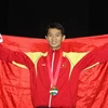 Vận động viên Diệp Ngọc Vũ Minh nhận huy chương vàng. (Ảnh: Quốc Khánh/TTXVN)