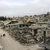 Một ngôi làng tại thị trấn Kobane, Syria bị phá hủy ngày 27/3 vừa qua. (Ảnh: AFP/TTXVN)