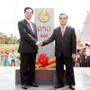 Thủ tướng Nguyễn Tấn Dũng và Thủ tướng Thongsing Thammavong tại Lễ khánh thành cột mốc đại số 460. (Ảnh: Đức Tám/TTXVN)