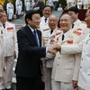 Chủ tịch nước Trương Tấn Sang với các thế hệ tướng lĩnh Công an qua các thời kỳ. (Ảnh: Nguyễn Khang/TTXVN)