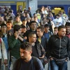 Người di cư tại nhà ga ở Munich của Đức ngày 12/9 vừa qua. (Ảnh: AFP/TTXVN)
